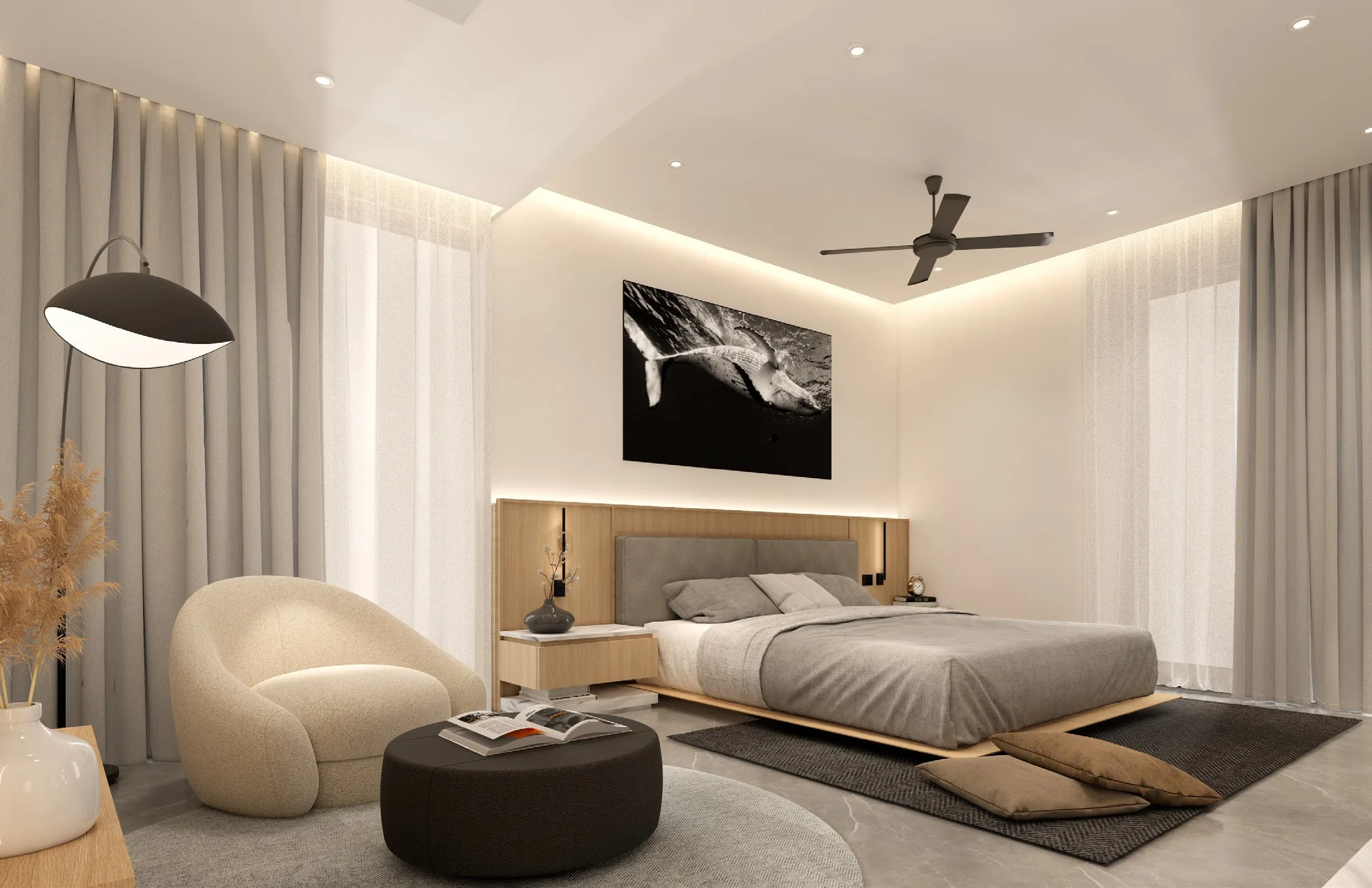 Bedroom with a sculptural lounge chair, soft drapes and a cove-lit ceiling