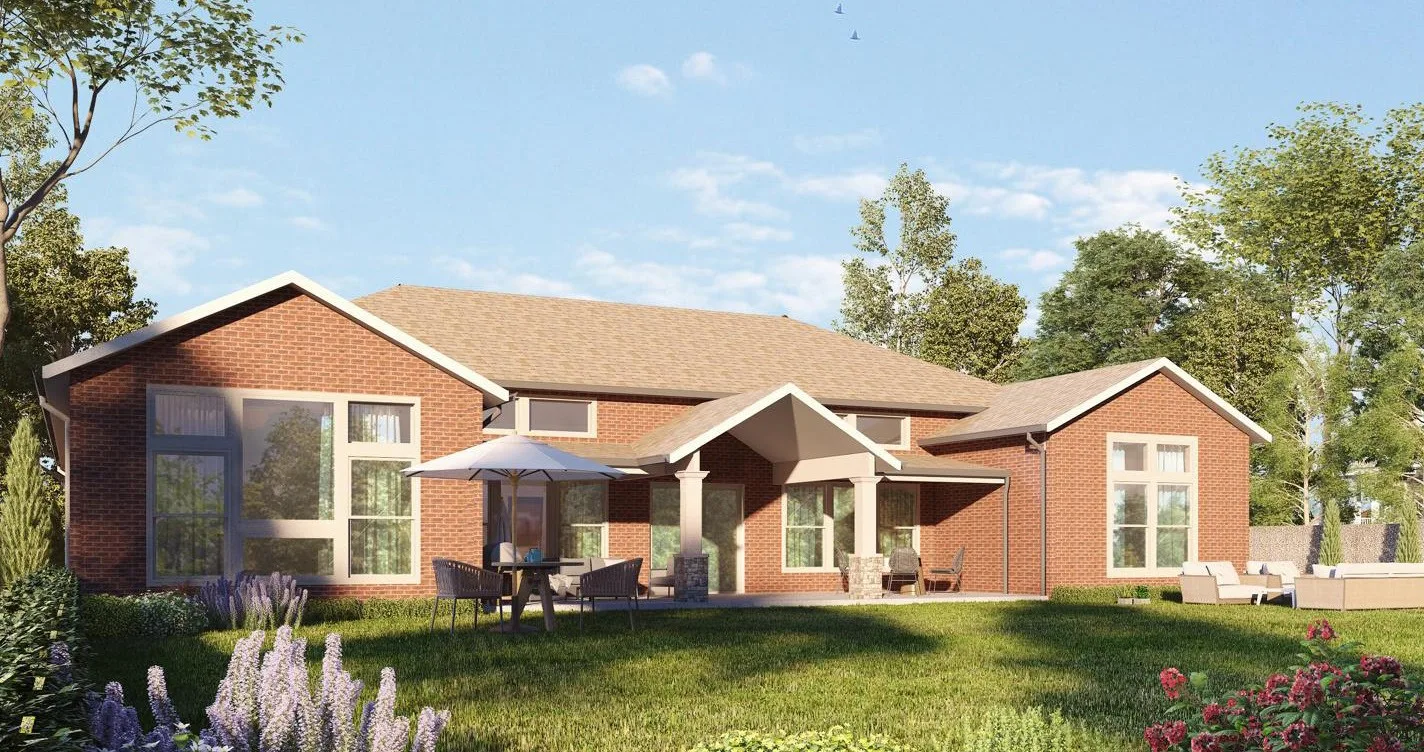 Brick cottage-style home with deep porch and gable roof under a blue sky