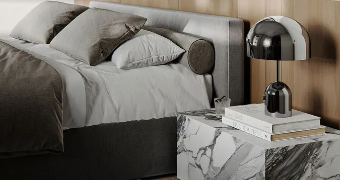 Bedside table with a black lamp on a marble top