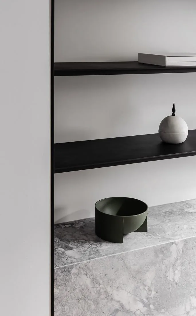 Marble surface with a dark ceramic object